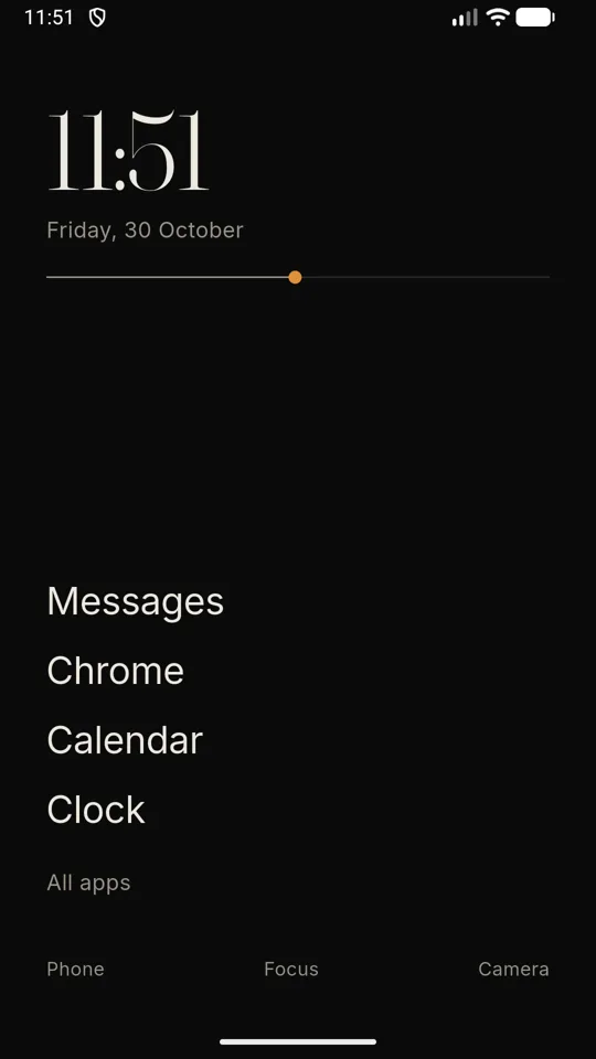 Sparse home screen: a large clock, the date, a thin day line and five apps written as text